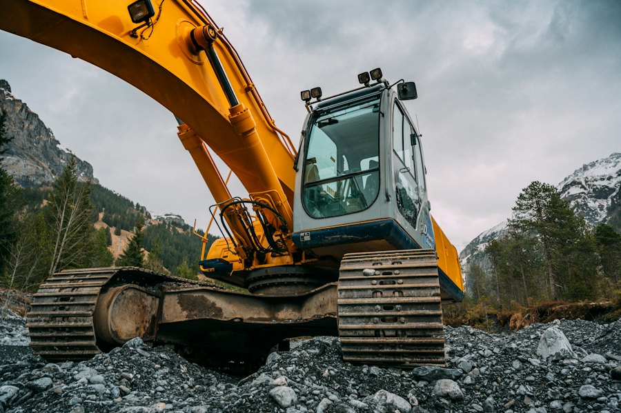 A yellow excavator on a building site