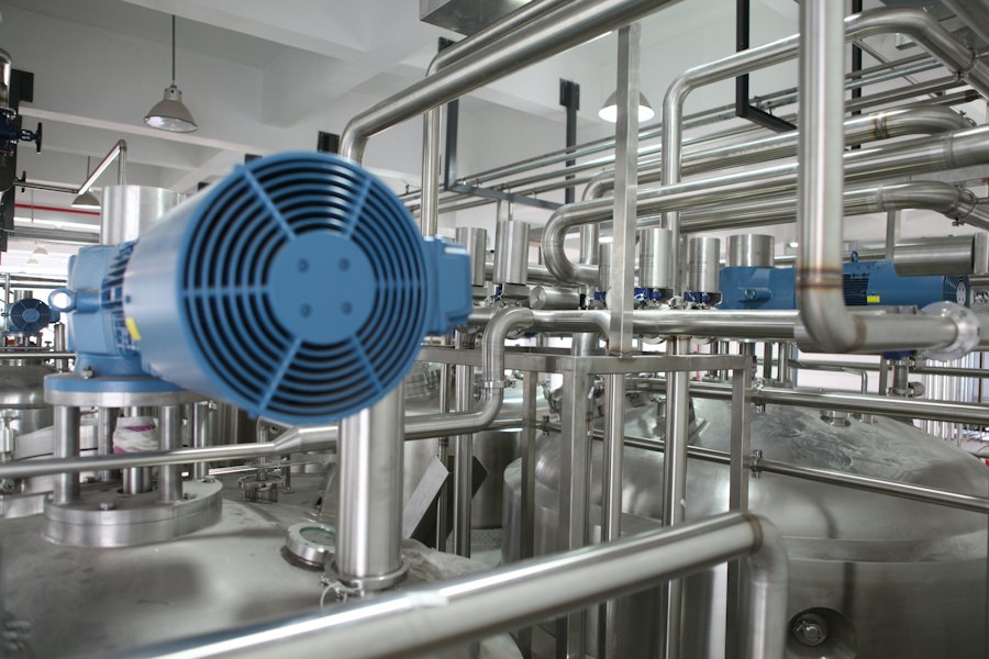 Large industrial pumps and motors in a plant room