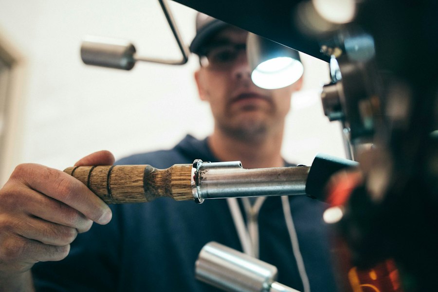 A worker using a welding torch